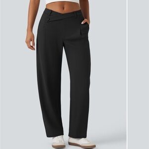 Black trousers with asymmetric waist